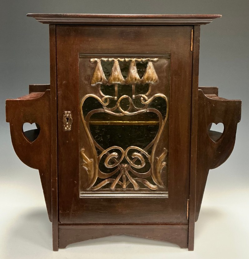 Art Nouveau carved mahogany wall cabinet being researched in Curalto